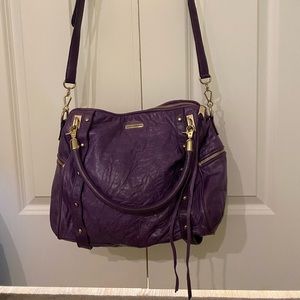 Rebecca Minkoff satchel with crossbody strap and handles.
